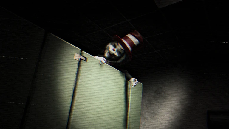 A grinning figure in a tall striped hat leans over the top of a toilet cubicle partition in a dark room.